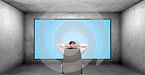 Businessman looking on plasma panel