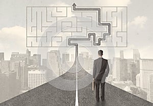 Businessman looking at road with maze and solution