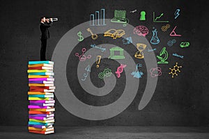 Businessman looking through a telescope