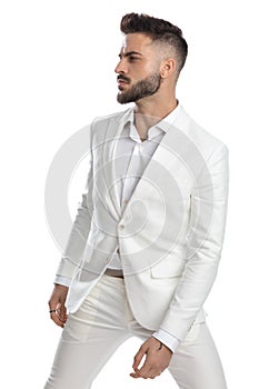 Businessman looking to the side with his hands loose