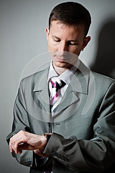 Businessman looking at watch