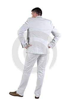 Businessman looks ahead. rear view. Isolated over white .