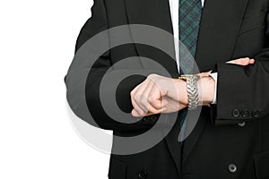 Businessman looks the time on his wristwatch.