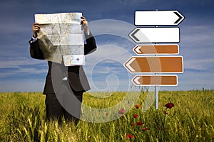 Businessman lost in field