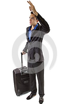 Businessman with luggage hailing an imaginary cab