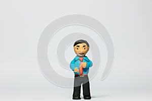 Businessman made from plasticine on white background, aligned in the center