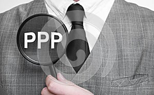 Businessman with magnifying glass on the white background. PPP sign