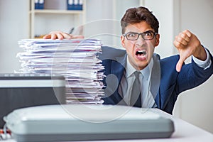 The businessman making copies in copying machine