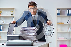 The businessman making copies in copying machine