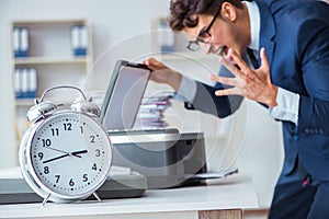 The businessman making copies in copying machine