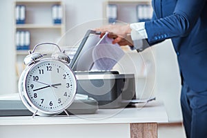 The businessman making copies in copying machine