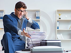 Businessman making copies in copying machine