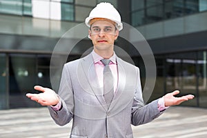 Businessman making helpless gesture