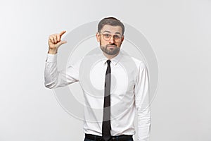 Businessman making his fingers the small size. emotions, facial expressions, feelings, body language, signs. image on a