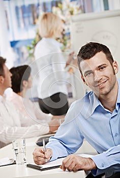 Businessman making notes on meeting