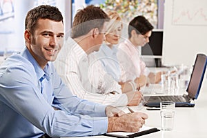 Businessman making notes on presentation