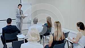 Businessman making presentation on staff meeting at office