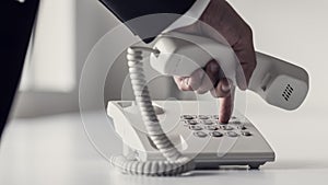 Dialing a phone number on a classical white landline device