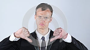 Businessman making thumbs down gesture with both hands