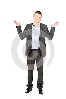 Businessman making undecided gesture