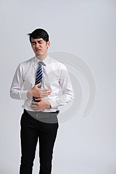 Businessman man feeling sick, having painful stomachache photo
