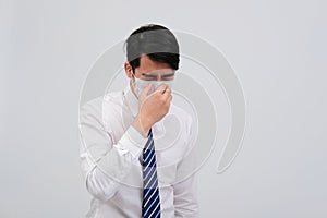 Businessman man feeling sick, sneezing coughing wearing protective mask against cold flu virus bacteria infection pollution