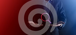 Businessman, man hold in hand magnifying glass icon.business, technology and internet concept