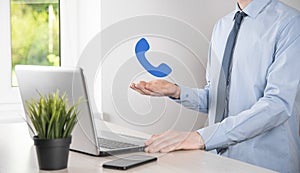 Businessman man hold phone icon.Call Now Business Communication Support Center Customer Service Technology Concept