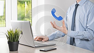 Businessman man hold phone icon.Call Now Business Communication Support Center Customer Service Technology Concept