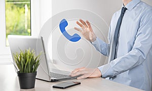 Businessman man hold phone icon.Call Now Business Communication Support Center Customer Service Technology Concept
