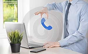 Businessman man hold phone icon.Call Now Business Communication Support Center Customer Service Technology Concept