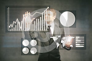 Businessman managing business graphs