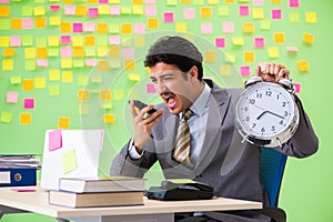 Businessman with many conflicting priorities in time management