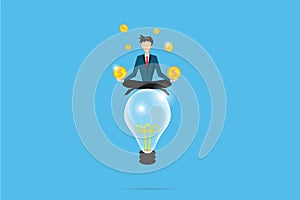 Businessman meditating with coins on lightbulb, idea and business concept