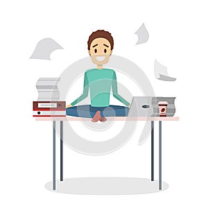 Businessman meditating in a lotus pose on the desk