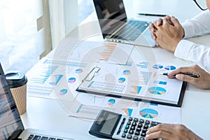 businessman in meeting analysis chart graphy