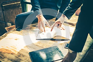 Businessman meeting about business plan and marketing in the future. they are looking and point finger to detail in notebook