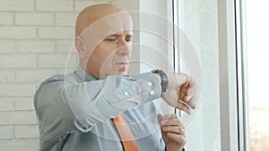 Businessman Before a Meeting Looking on Window and Check Hand Watch Time