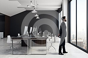 Businessman in modern coworking office interior photo