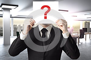 Businessman in modern office hides face behind sign question mark 3D Illustration