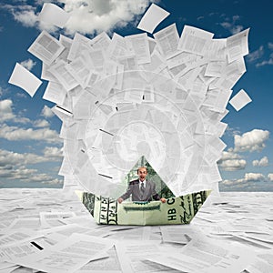 Businessman in money boat under wave of documents photo