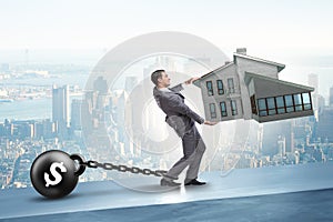 The businessman in mortgage debt financing concept