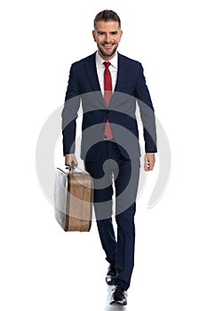 Businessman moving towards his vacation with a big smile