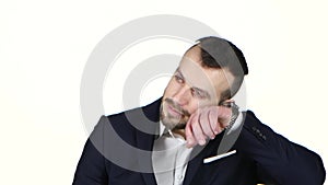 Businessman nervously waits and checks the his watch. White background