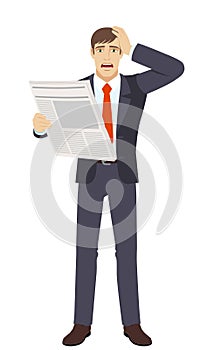 Businessman with newspaper grabbed his head