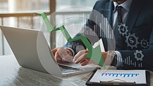 Businessman in Office Analyzing Financial Data on Laptop