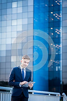 Businessman and office block