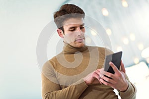 Businessman in office building holding digital tablet