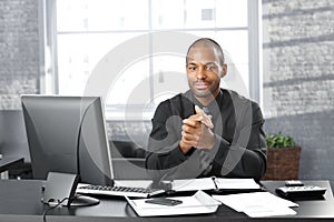 Businessman at office desk photo