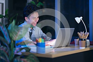 Businessman in the office at night working late